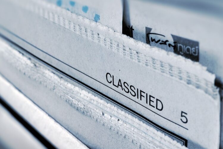 Close-up of the classified section of a newspaper